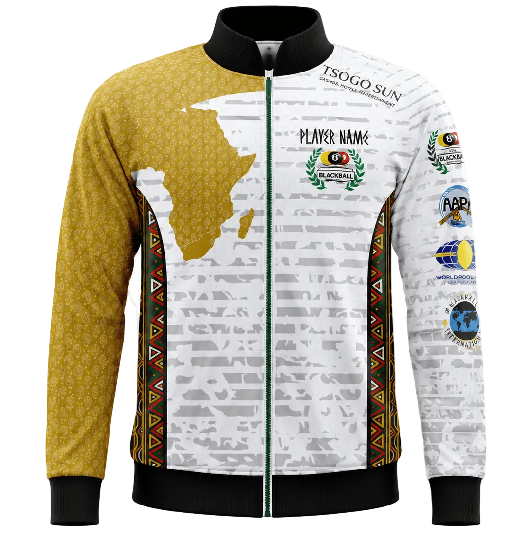 A long-sleeve zip-up athletic jacket with a black collar, cuffs, and hem. The left side is mustard yellow with a subtle honeycomb pattern, while the right side is white with a gray newspaper print, a gold silhouette of Africa, and various colorful event sponsor patches.