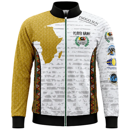A long-sleeve zip-up athletic jacket with a black collar, cuffs, and hem. The left side is mustard yellow with a subtle honeycomb pattern, while the right side is white with a gray newspaper print, a gold silhouette of Africa, and various colorful event sponsor patches.