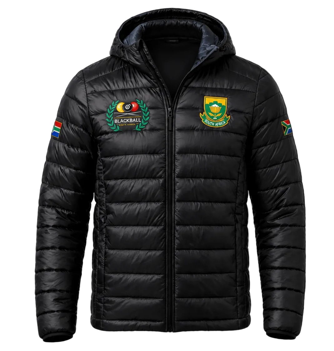 A black hooded puffer jacket with quilted horizontal stitching, featuring a South Africa national team crest on the left chest, a team emblem on the right chest, and colorful sleeve patches, displayed against a dark background.